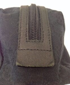 Black fabric bag with visible zipper detail.