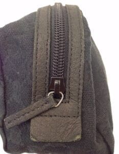 Black fabric pouch with a zipper closure.