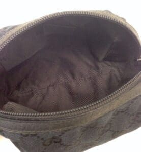 Empty black fabric pouch with open zipper.