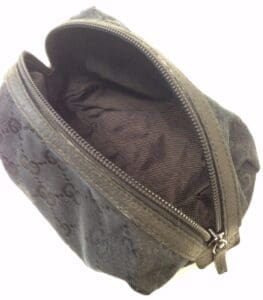 Open black fabric pouch with zipper.