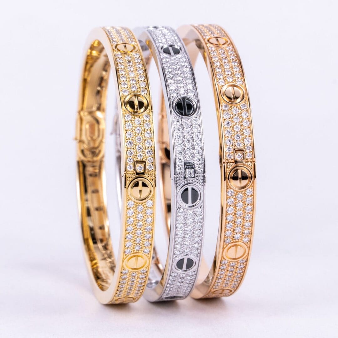 Gold, silver, rose gold diamond-encrusted bracelets.