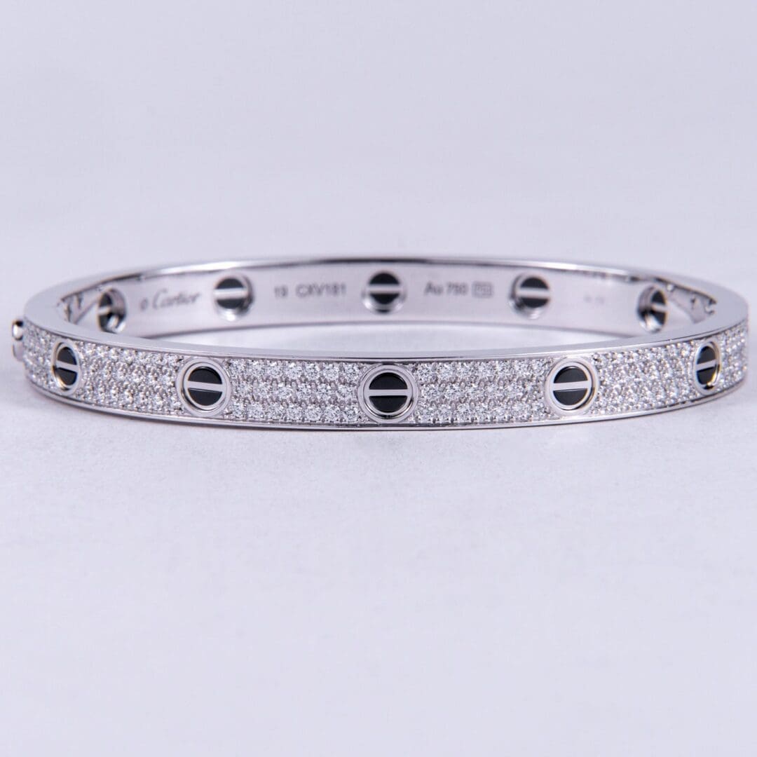 Silver bracelet with diamond accents.