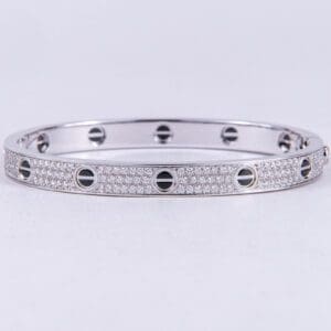 Silver diamond bracelet with screw motif design.