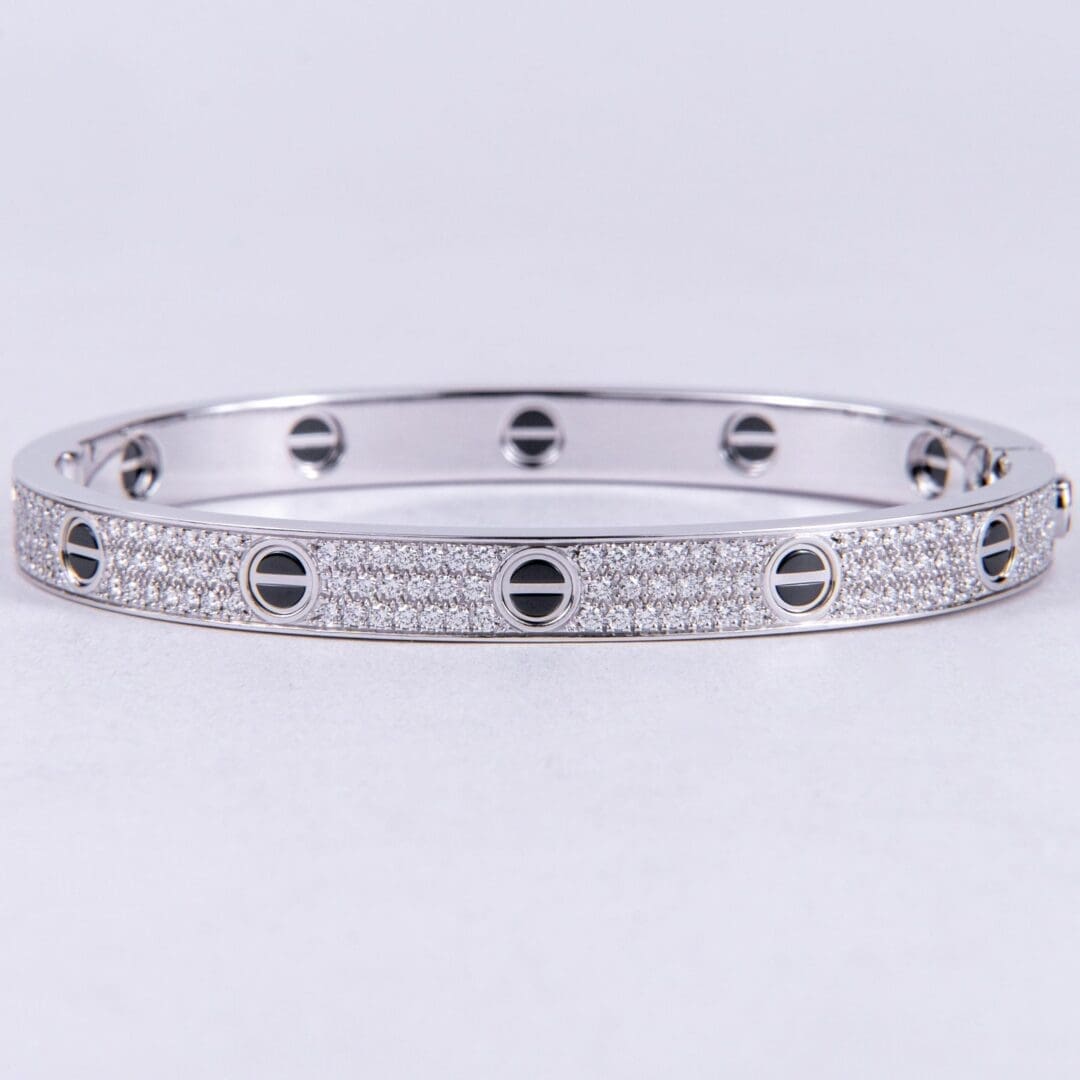 Silver diamond bracelet with screw motif design.