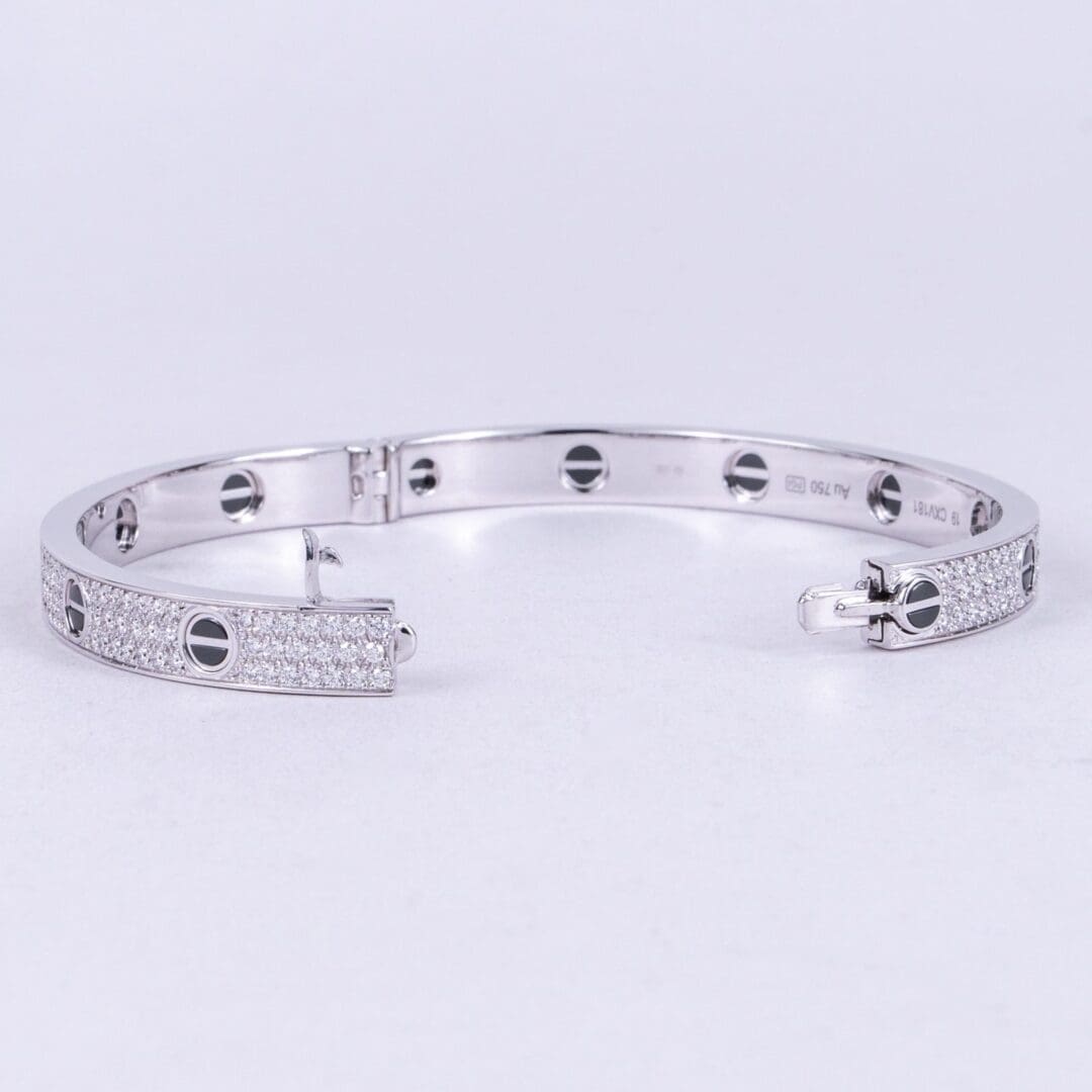 Silver bracelet with diamond accents.