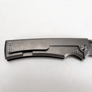 Closed folding knife on white background.