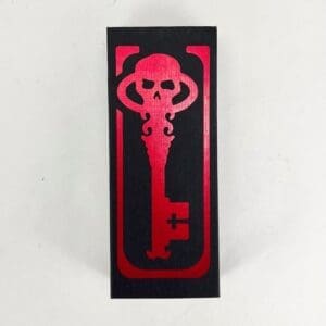 Red skull key design on black background.