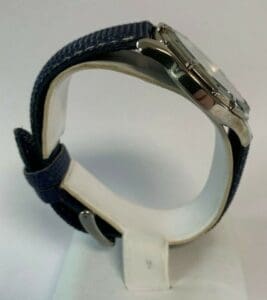 Silver watch with blue fabric strap.