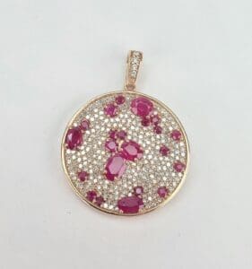 Gold pendant with rubies and diamonds.