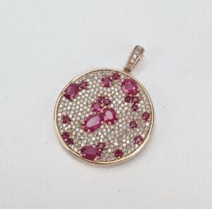 Gold pendant with rubies and diamonds.