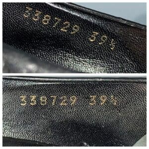 Black leather shoes with embossed numbers.