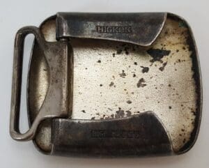 Vintage metal belt buckle with "Hickok" engraving.