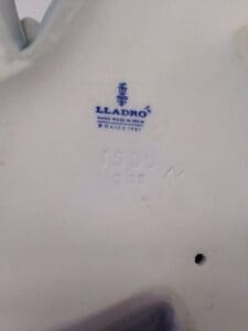 Lladro porcelain marking with logo and numbers.