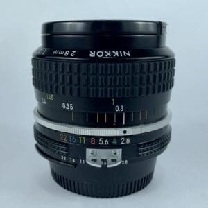 Nikon 28mm camera lens with focus markings.