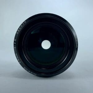 Camera lens with visible aperture blades.