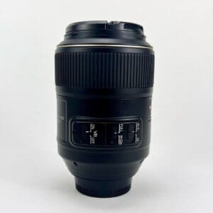 Camera lens with switches on white background.