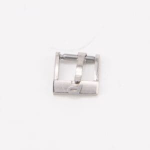 Silver metal watch buckle on white background.