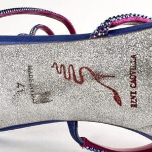 Silver high heel shoe sole with logo.