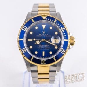 Gold and silver Rolex Submariner watch.