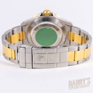 Two-tone wristwatch with stainless steel clasp.
