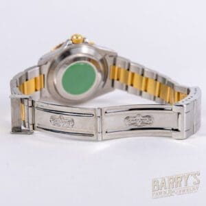 Silver and gold wristwatch with clasp.