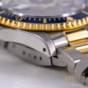 Close-up of a luxury watch's metal bracelet.