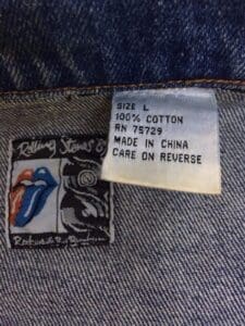 Denim label with size and care instructions.