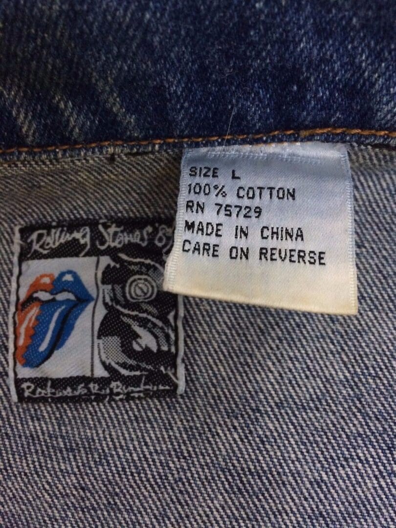 Denim label with size and care instructions.