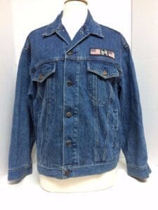 Denim jacket with American flag patch.