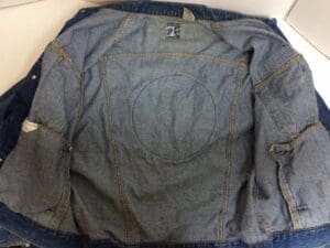 Inside view of a denim jacket.