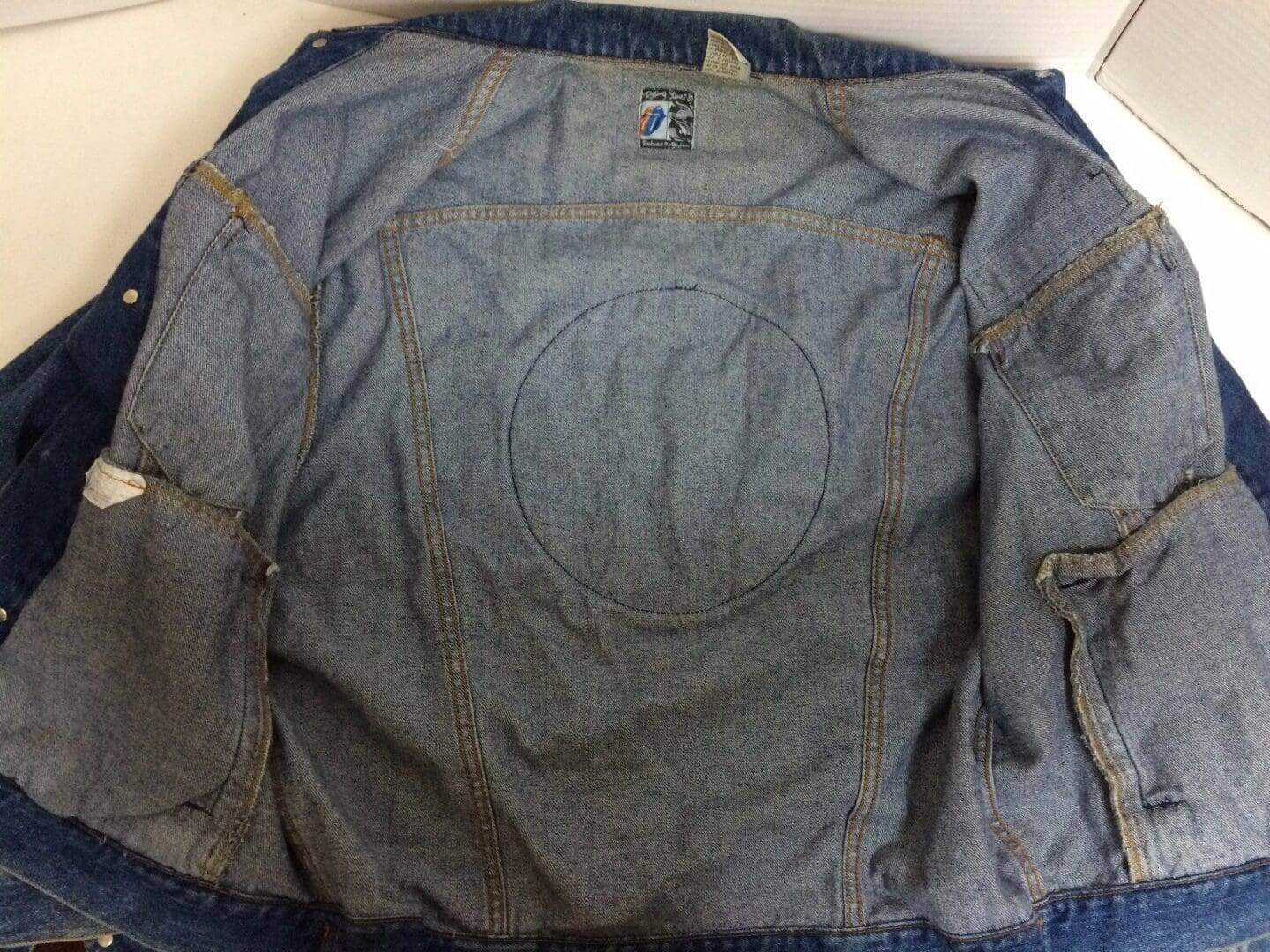 Inside view of a denim jacket.
