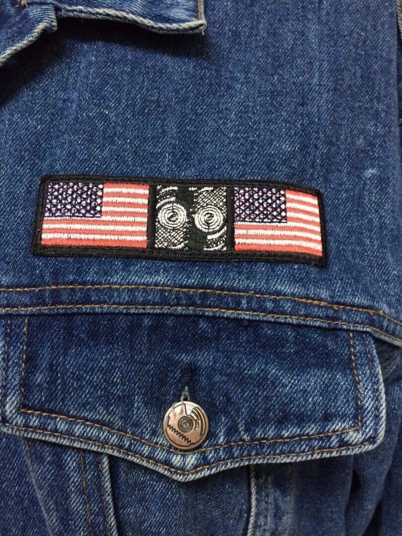 Denim jacket with American flag patch.