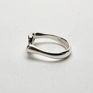 Silver ring with unique, modern design.