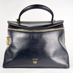 Black leather handbag with gold zipper.