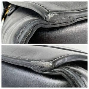 Worn edges of black leather bag.