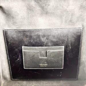 Black leather Tom Ford pocket interior label.