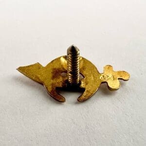 Golden decorative screw on white background.
