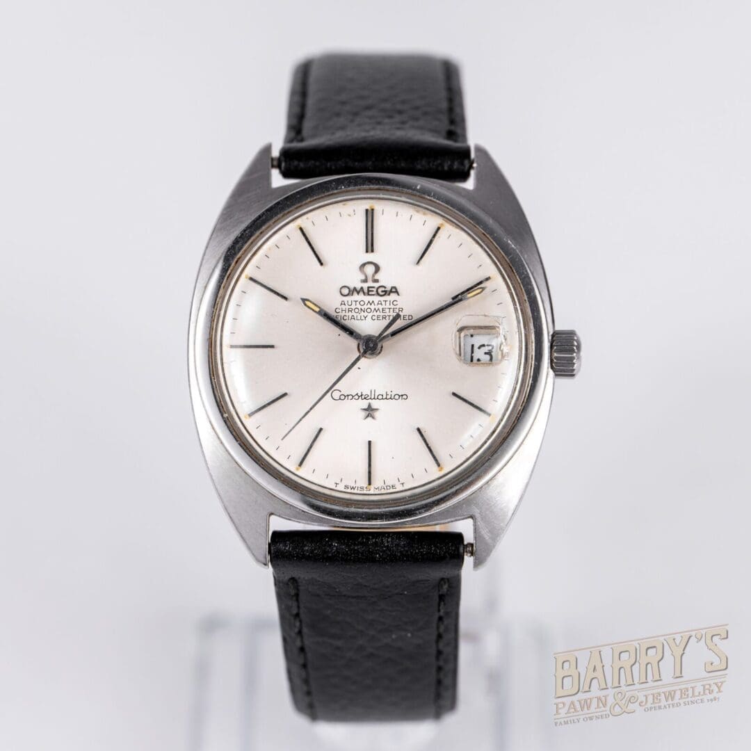 Vintage Omega Constellation watch with date display.