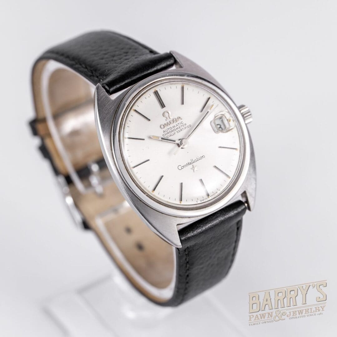 Vintage wristwatch with black leather strap.