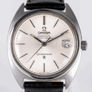Silver Omega Constellation watch with date display.