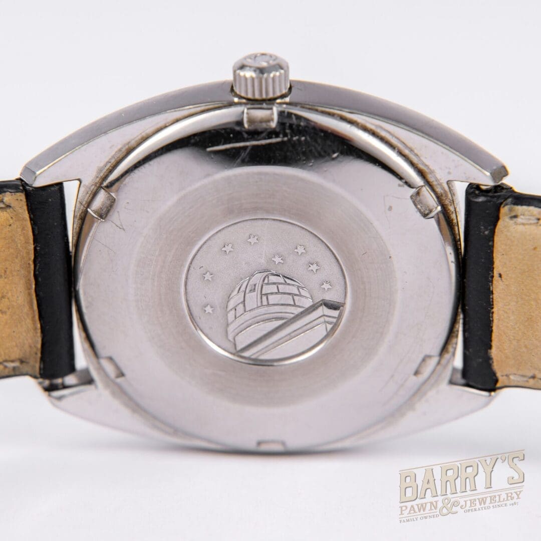 Watch back with engraved observatory design.