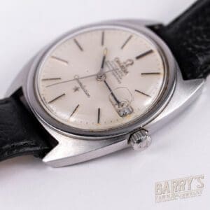 Vintage wristwatch with black leather strap.