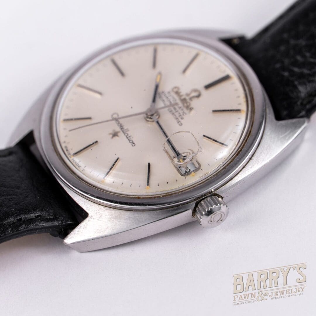 Vintage wristwatch with black leather strap.