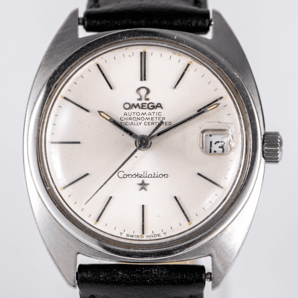 Silver Omega Constellation watch with date display.